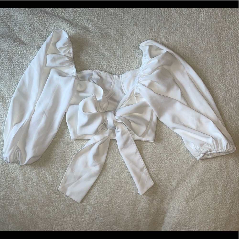 White long sleeve blouse with puff sleeves and a tie back. - Picture 4 of 5